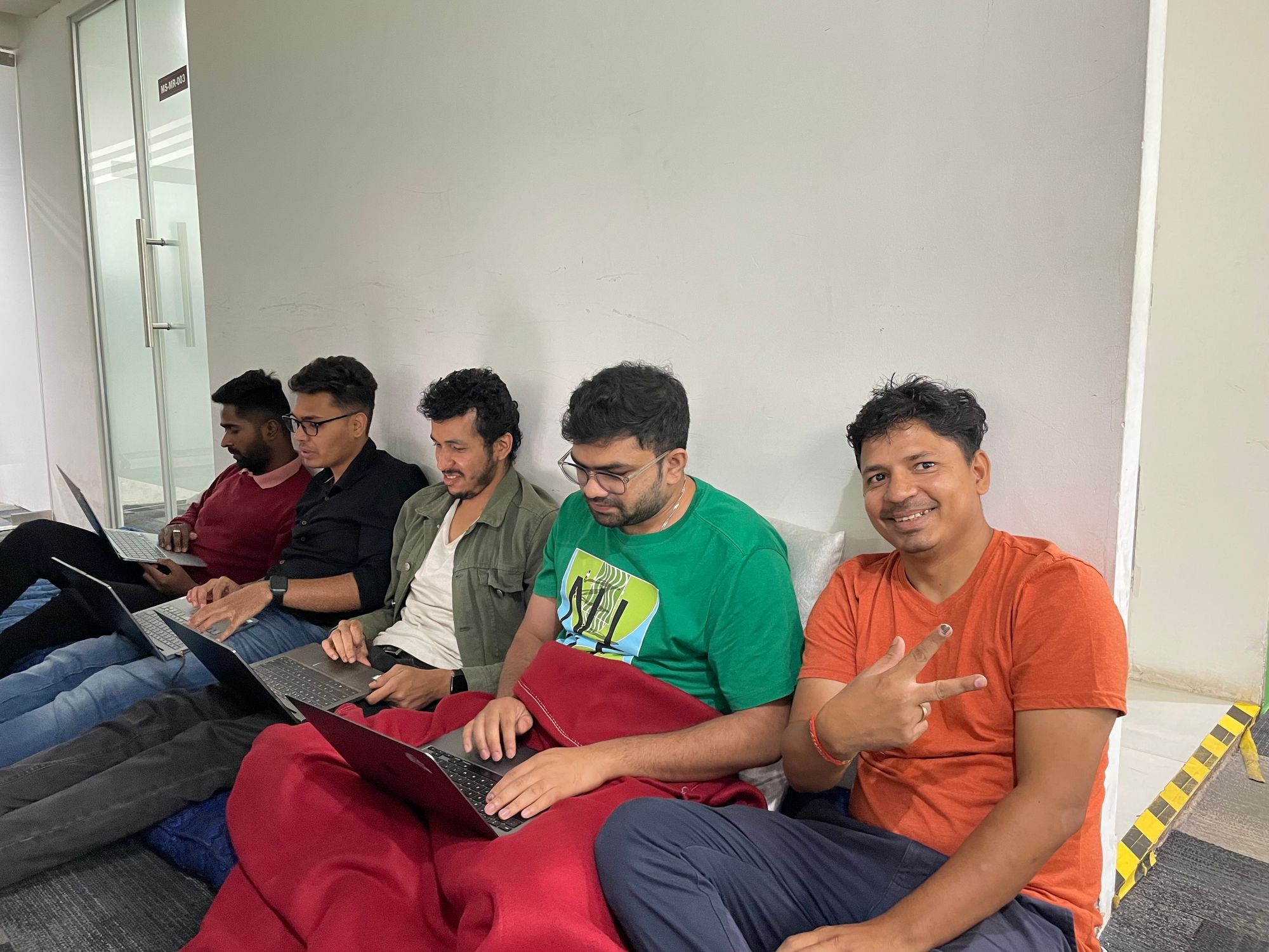 Image shows Masai employees participating in the AI Hackathon