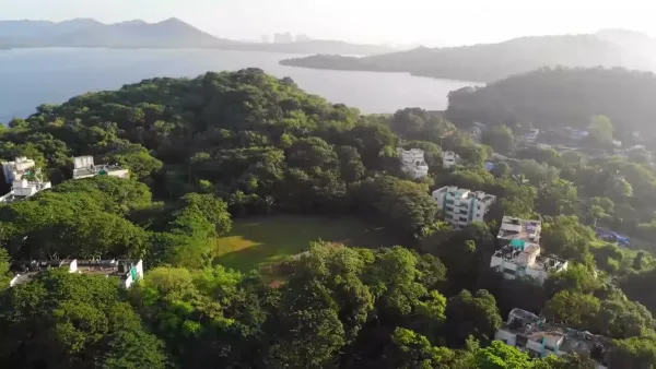 Aerial view of the IIM Mumbai campus beside the Powai and Vihar lakes